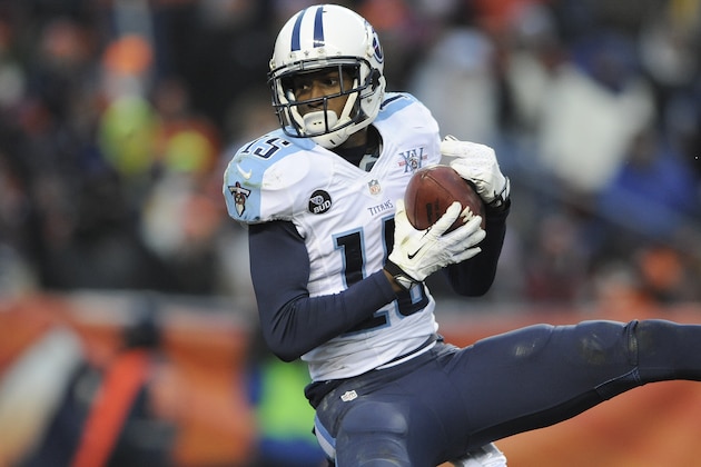 Tennessee Titans wide receiver Justin Hunter hails in a touchdown past during the second half of an NFL football game against the Denver Broncos on Sunday, Dec. 8, 2013, in Denver. (AP Photo/Chris Schneider)