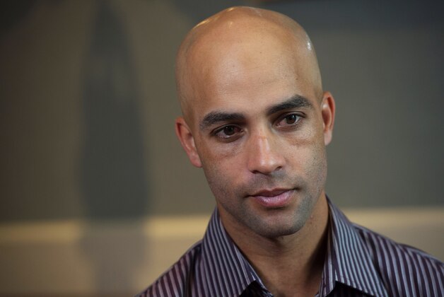 Former tennis star James Blake discusses his mistaken arrest by the New York City Police Department during an interview, Saturday, Sept. 12, 2015, in New York. Video surveillance released Friday of the mistaken arrest shows a plainclothes police officer who has a history of excessive-force complaints grabbing Blake by the arm and tackling him to the ground. (AP Photo/Bryan R. Smith)