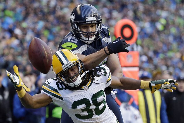 FILE - In this Sunday, Jan. 18, 2015, file photo, Green Bay Packers' Tramon Williams (38) breaks up a pass intended for Seattle Seahawks' Jermaine Kearse during the second half of the NFC championship NFL footbal lgame in Seattle. Kearse was having an NFC championship game to forget until the final play. That's when the Seahawks receiver added yet another memorable postseason touchdown to his resume. (AP Photo/Elaine Thompson, File)