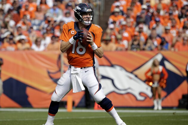 Denver Broncos quarterback Peyton Manning drops back to pass against the Baltimore Ravens during an NFL football game between the Denver Broncos and the Baltimore Ravens Sunday, Sept. 13, 2015, in Denver. Denver beat Baltimore 19-13. (AP Photo/Jack Dempsey)