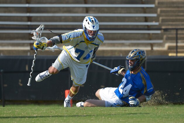 CHARLOTTE, NC - JULY 11:  Lyle Thompson #74 of the Florida Launch moves the ball against Ryan Flanagan #24 of the Charlotte Hounds during their game at American Legion Memorial Stadium on July 11, 2015 in Charlotte, North Carolina. Florida won 17-16 in overtime.  (Photo by Grant Halverson/Getty Images)