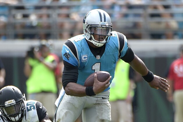 Carolina Panthers quarterback Cam Newton (1) scrambles for yardage past Jacksonville Jaguars outside linebacker Telvin Smith (50) during the second half of an NFL football game in Jacksonville, Fla., Sunday, Sept. 13, 2015. The Panthers won 20-9. (AP Photo/Phelan M. Ebenhack)
