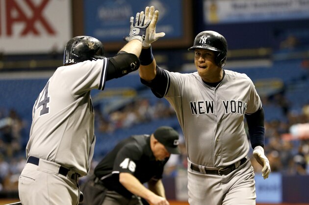 ST. PETERSBURG, FL - SEPTEMBER 15:  Alex Rodriguez #13 of the New York Yankees celebrates with teammate Brian McCann #34 after hitting a home run off of pitcher Jake Odorizzi of the Tampa Bay Rays during the first inning of a game on September 15, 2015 at Tropicana Field in St. Petersburg, Florida.  (Photo by Brian Blanco/Getty Images)