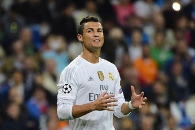 Real Madrid's Portuguese forward Cristiano Ronaldo gestures during the UEFA Champions League group A football match Real Madrid CF vs FC Shakhtar Donetsk at the Santiago Bernabeu stadium in Madrid on September 15, 2015. AFP PHOTO/ PIERRE-PHILIPPE MARCOU        (Photo credit should read PIERRE-PHILIPPE MARCOU/AFP/Getty Images)