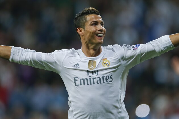 Real Madrid's Cristiano Ronaldo celebrates after scoring after an hat trick during a Group A Champions League soccer match between Real Madrid and Shakhtar Donetsk at the Santiago Bernabeu stadium in Madrid, Spain, Tuesday, Sept. 15, 2015. (AP Photo/Paul White)