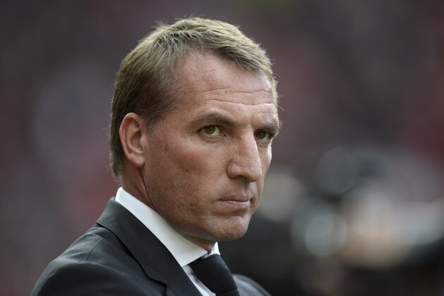 Liverpool's Northern Irish manager  Brendan Rodgers arrives for the English Premier League football match between Manchester United and Liverpool at Old Trafford in Manchester, north west England, on September 12, 2015. AFP PHOTO / OLI SCARFF

RESTRICTED TO EDITORIAL USE. No use with unauthorized audio, video, data, fixture lists, club/league logos or 'live' services. Online in-match use limited to 75 images, no video emulation. No use in betting, games or single club/league/player publications.        (Photo credit should read OLI SCARFF/AFP/Getty Images)