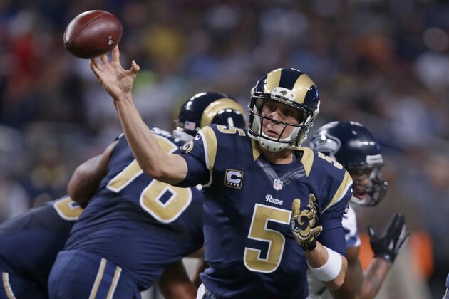 St. Louis Rams quarterback Nick Foles throws during the second quarter of an NFL football game Sunday, Sept. 13, 2015, in St. Louis. (AP Photo/Tom Gannam)