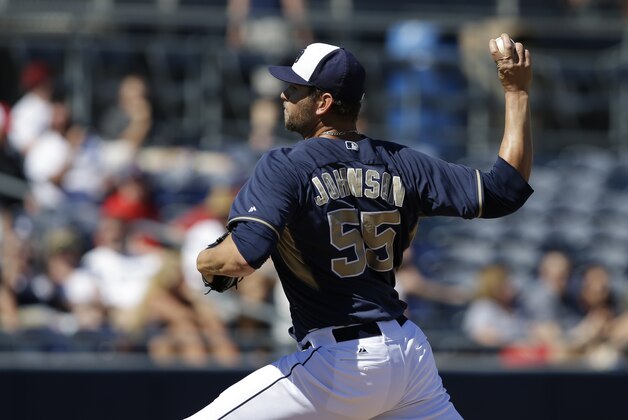 San Diego Padres' Josh Johnson (55) throws during an exhibition spring training baseball game against the San Diego Padres Saturday, March 8, 2014, in Peoria, Ariz. (AP Photo/Darron Cummings)