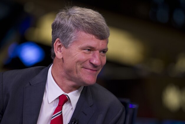 David Gill, chief executive officer of Manchester United, listens during a television interview from the floor of the New York Stock Exchange on Friday, Aug. 10, 2012 in New York. (AP Photo/Jin Lee)