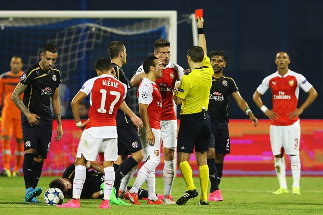 ZAGREB, CROATIA - SEPTEMBER 16:  Olivier Giroud of Arsenal is shown the red card by referee Ovidiu Hategan during the UEFA Champions League Group F match between Dinamo Zagreb and Arsenal at Maksimir Stadium on September 16, 2015 in Zagreb, Croatia.  (Photo by Alexander Hassenstein/Getty Images)