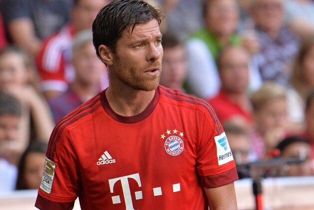 Bayern's Xabi Alonso during the German Bundesliga soccer match between FC Bayern Munich and FC Augsburg in the Allianz Arena in Munich, Germany, on Saturday, Sep. 12, 2015. (AP Photo/Kerstin Joensson)