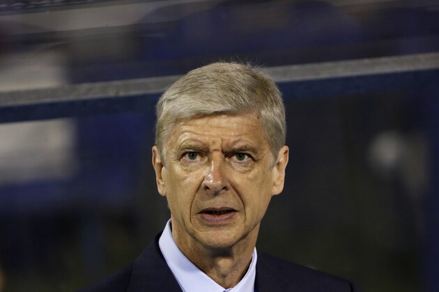 Arsenal's manager Arsene Wenger looks out from the bench during a Champions League Group F soccer match between Dinamo Zagreb and Arsenal at the Maksimir Stadium in Zagreb, Croatia, Wednesday Sept. 16, 2015. (AP Photo/Darko Bandic)
