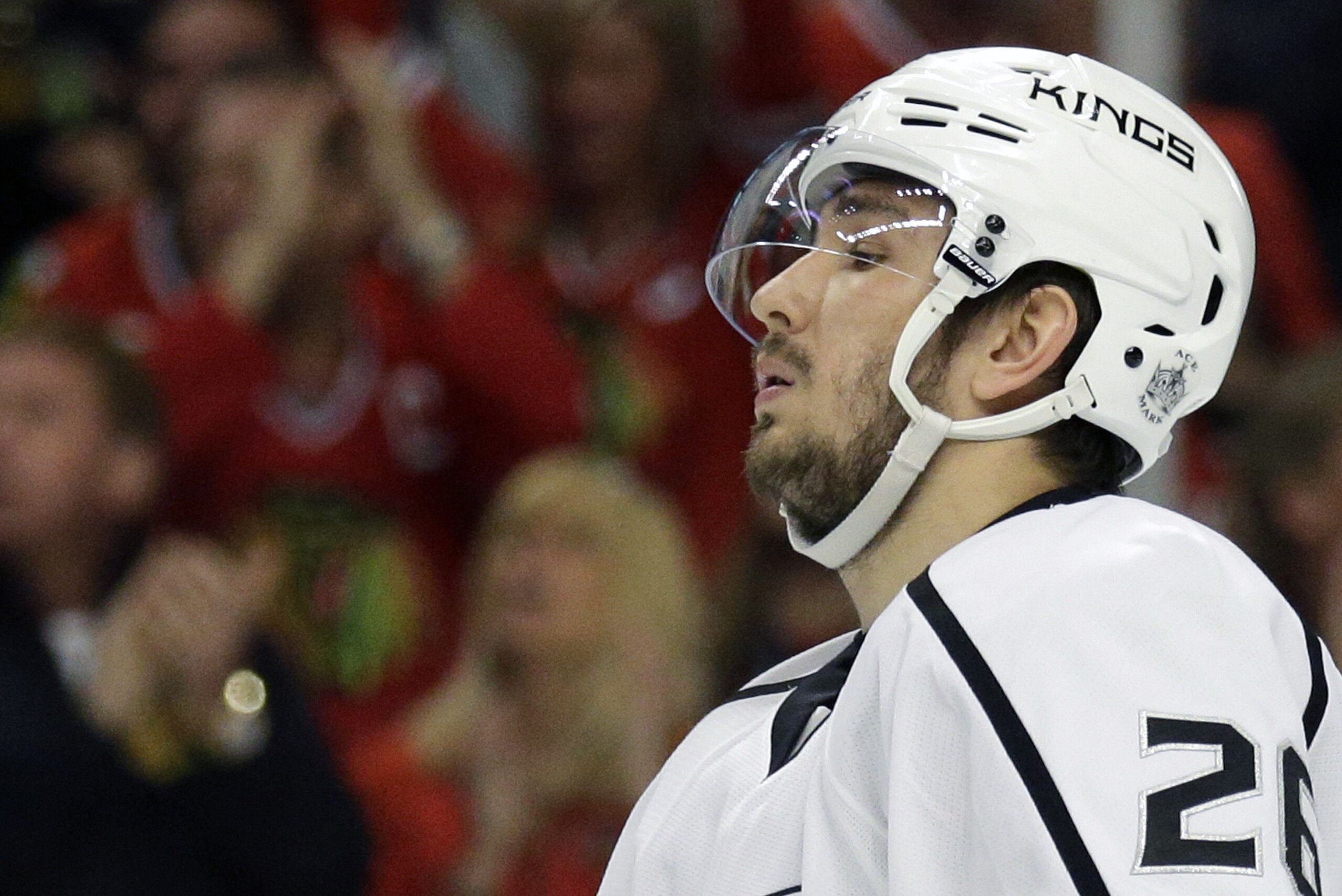 FILE - In this May 18, 2014, file photo, Los Angeles Kings' Slava Voynov reacts  during Game 1 of the Western Conference finals in the NHL hockey Stanley Cup playoffs in Chicago. Los Angeles Superior Court Judge Hector M. Guzman ruled Monday Dec. 15, 2014, that there is enough evidence for Voynov to stand trial on a felony domestic violence charge filed after his wife was injured during an argument in October. Voynov has pleaded not guilty and his attorney said in court Monday, Dec. 15, 2014 that his wife has since written a letter to prosecutors describing the incident as an accident. (AP Photo/Nam Y. Huh, File)