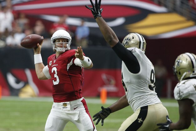 Arizona Cardinals quarterback Carson Palmer (3) throws under pressure from New Orleans Saints defensive end Cameron Jordan (94) during the first half of an NFL football game, Sunday, Sept. 13, 2015, in Glendale, Ariz. (AP Photo/Ross D. Franklin)