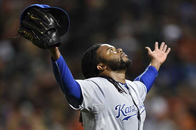 Kansas City Royals starting pitcher Johnny Cueto reacts as he walks off the field after getting the third out against the Baltimore Orioles in the fifth inning inning of a baseball game, Sunday, Sept. 13, 2015, in Baltimore.  Cueto gave up a home run to Chris Davis in the inning and was trailing 6-2. (AP Photo/Gail Burton)