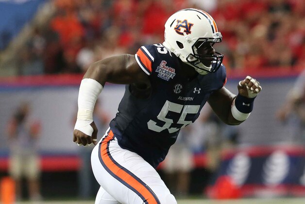 Auburn defensive lineman Carl Lawson (55) rubs against Louisville during the first half of an NCAA college football game, Saturday, Sept. 5, 2015, in Atlanta. (AP Photo/John Bazemore)
