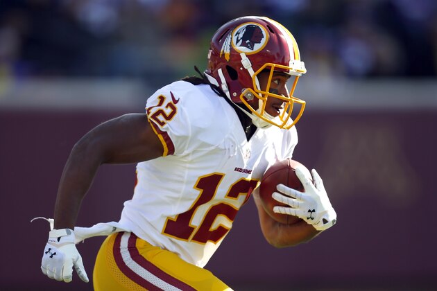Washington Redskins wide receiver Andre Roberts (12) returns a kick against the Minnesota Vikings during an NFL football game, Sunday, Nov. 2, 2014, in Minneapolis. (Jeff Haynes/AP Images for Panini)