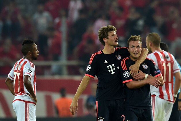 Bayern Munich's German forward Thomas Mueller (L) and German midfielder Mario Goetze celebrate after they won against Olympiakos during the Group F Champions League football match at the Karaiskaki stadium in Athens on September 16, 2015. AFP PHOTO / ARIS MESSINIS (Photo credit should read ARIS MESSINIS/AFP/Getty Images) Bayern Munich's German forward Thomas Mueller (L) and German midfielder Mario Goetze celebrate after they won against Olympiakos during the Group F Champions League football match at the Karaiskaki stadium in Athens on September 16, 2015. AFP PHOTO / ARIS MESSINIS (Photo credit should read ARIS MESSINIS/AFP/Getty Images)