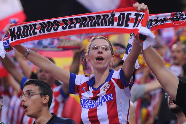 MADRID, SPAIN - SEPTEMBER 12:  A Club Atheltico de Madrid fan cheers on her team during the La Liga match between Club Atletico de Madrid and FC Barcelona at Vicente Calderon Stadium on September 12, 2015 in Madrid, Spain.  (Photo by Denis Doyle/Getty Images)