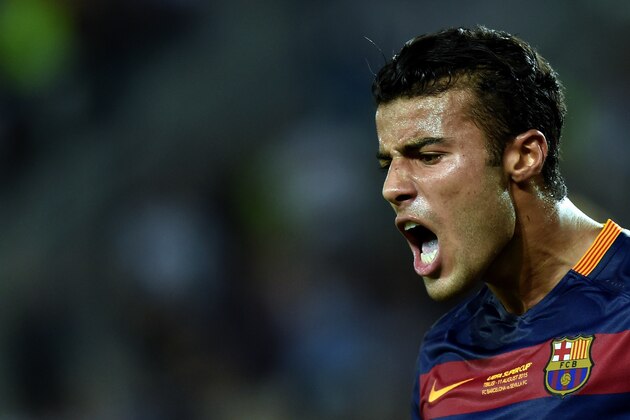 Barcelona's midfielder Rafinha celebrates after scoring a goal during the UEFA Super Cup final football match between FC Barcelona and Sevilla FC on August 11, 2015 at the Boris Paichadze Dinamo Arena in Tbilisi. AFP PHOTO / KIRILL KUDRYAVTSEV        (Photo credit should read KIRILL KUDRYAVTSEV/AFP/Getty Images)