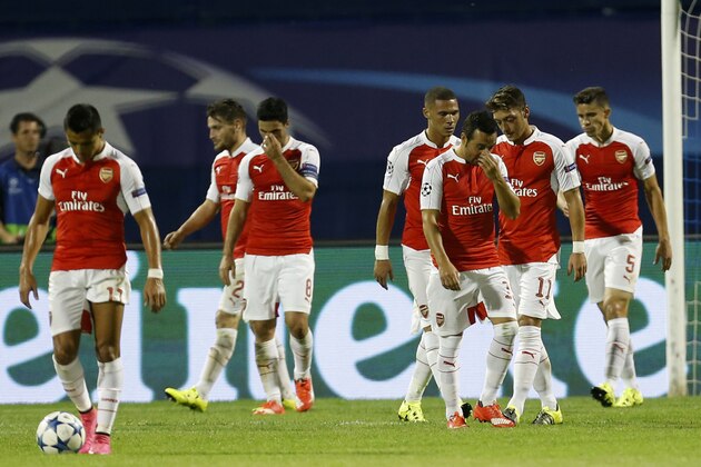 Arsenal players walk back to the half way line after Dinamo scored their 2nd goal during a Champions League Group F soccer match between Dinamo Zagreb and Arsenal at the Maksimir Stadium in Zagreb, Croatia, Wednesday Sept. 16, 2015. (AP Photo/Darko Bandic) Arsenal players walk back to the half way line after Dinamo scored their 2nd goal during a Champions League Group F soccer match between Dinamo Zagreb and Arsenal at the Maksimir Stadium in Zagreb, Croatia, Wednesday Sept. 16, 2015. (AP Photo/Darko Bandic)