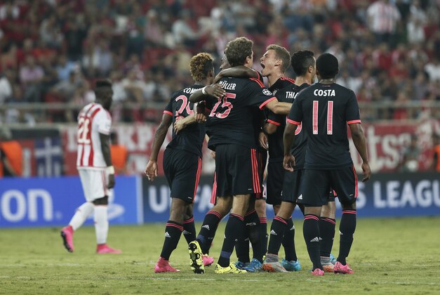 Bayern's players celebrate the third goal scored by their team, during a Champions League Group F soccer match between Olympiakos and Bayern Munich at Georgios Karaiskakis stadium in Piraeus port, near Athens, Wednesday, Sept. 16, 2015. (AP Photo/Petros Giannakouris)