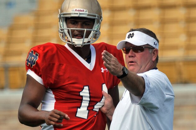 Notre Dame coach Brian Kelly, right, talks to quarterback DeShone Kizer at practice during media day for the NCAA college football team Tuesday Aug. 19, 2014, in South Bend, Ind. (AP Photo/Joe Raymond)