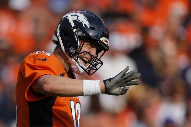Denver Broncos quarterback Peyton Manning signals a wide receiver during an NFL football game between the Denver Broncos and the Baltimore Ravens Sunday, Sept. 13, 2015, in Denver. Denver beat Baltimore 19-13. (AP Photo/Jack Dempsey)