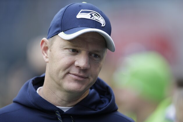 Seattle Seahawks offensive coordinator Darrell Bevell stands on the field during warmups before an NFL football game against the St. Louis Rams, Dec. 28, 2014, in Seattle. (AP Photo/Scott Eklund)