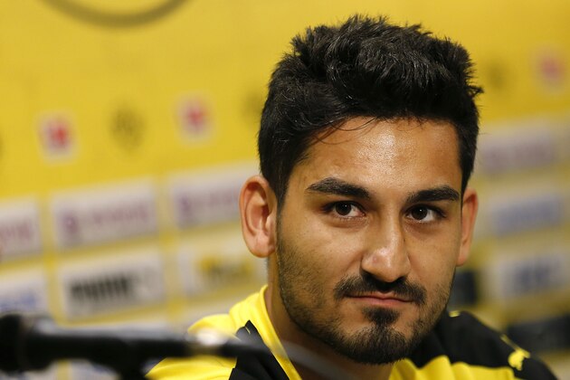 German soccer club Borussia Dortmund's Ilkay Guendogan listens to questions during a press conference, Wednesday, July 8, 2015, in Singapore. The team is in the city-state as part of their Asian tour. (AP Photo/Wong Maye-E)