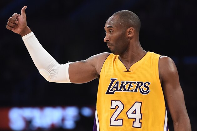 Kobe Bryant of the  Los Angeles Lakers gestures on court during NBA action against the Miami Heat at Staples Center in Los Angeles, California.  AFP PHOTO / ROBYN BECK        (Photo credit should read ROBYN BECK/AFP/Getty Images)