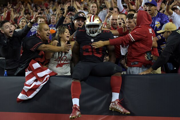 Sep 14, 2015; Santa Clara, CA, USA; San Francisco 49ers running back Carlos Hyde (28) celebrates with fans after scoring on a 17-yard touchdown run in the fourth quarter against the Minnesota Vikings at Levi's Stadium. Mandatory Credit: Kirby Lee-USA TODAY Sports