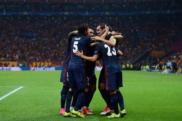 Atletico Madrid's Antoine Griezmann (unseen) celebrates with his team mates after scoring the second goal during the Champions League group C football match Galatasaray vs Atletico Madrid on September 15, 2015 at the TT Arena Stadium in Istanbul. AFP PHOTO / OZAN KOSE        (Photo credit should read OZAN KOSE/AFP/Getty Images)