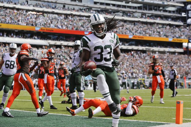 New York Jets running back Chris Ivory (33) celebrates after rushing for a touchdown during the first half of an NFL football game before an NFL football game between the Sunday, Sept. 13, 2015 in East Rutherford, N.J. (AP Photo/Kathy Willens)