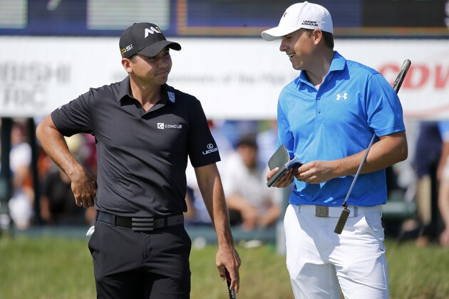 Jason Day, left, of Australia,  talks with Jordan Spieth on the 10th green, during the first round of the BMW Championship golf tournament at Conway Farms Golf Club, Thursday, Sept. 17, 2015, in Lake Forest, Ill. (AP Photo/Charles Rex Arbogast)