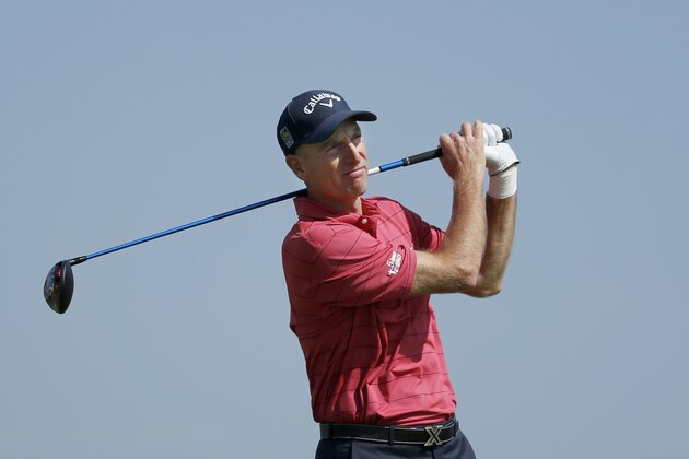 Jim Furyk watches his drive on the 10th tee during the first round of the BMW Championship golf tournament at Conway Farms Golf Club, Thursday, Sept. 17, 2015, in Lake Forest, Ill. Furyk withdrew from the tournament citing a left wrist injury. (AP Photo/Charles Rex Arbogast)