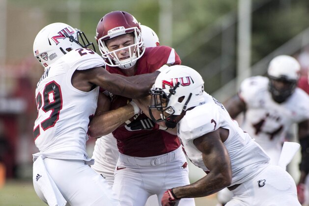 Sep 20, 2014; Fayetteville, AR, USA; Northern Illinois Huskies cornerback Paris Logan (29) and safety Marlon Moore (2) tackle Arkansas Razorbacks wide receiver Cody Hollister (81) during the first half of a game at Donald W. Reynolds Razorback Stadium. Arkansas defeated NIU 52-14. Mandatory Credit: Beth Hall-USA TODAY Sports Sep 20, 2014; Fayetteville, AR, USA; Northern Illinois Huskies cornerback Paris Logan (29) and safety Marlon Moore (2) tackle Arkansas Razorbacks wide receiver Cody Hollister (81) during the first half of a game at Donald W. Reynolds Razorback Stadium. Arkansas defeated NIU 52-14. Mandatory Credit: Beth Hall-USA TODAY Sports