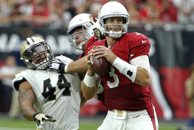 Arizona Cardinals quarterback Carson Palmer (3) looks to pass against the New Orleans Saints during the first half of an NFL football game, Sunday, Sept. 13, 2015, in Glendale, Ariz. (AP Photo/Ross D. Franklin)