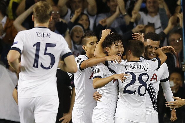 Tottenham’s Son Heung-Min, center, celebrates with teammates after scoring during the Europa League Group J soccer match between Tottenham Hotspur and Qarabag FK at the White Hart Lane stadium in London, England, Thursday, Sept. 17, 2015. (AP Photo/Frank Augstein)