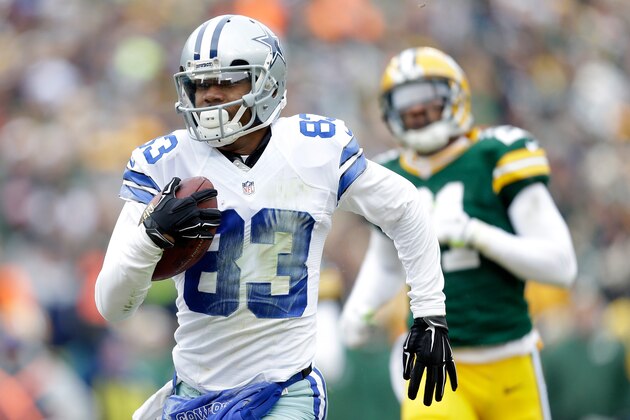 GREEN BAY, WI - JANUARY 11:  Terrance Williams #83 of the Dallas Cowboys runs in the football for a touchdown in the second quarter of the 2015 NFC Divisional Playoff game against the Green Bay Packers at Lambeau Field on January 11, 2015 in Green Bay, Wisconsin.  (Photo by Mike McGinnis/Getty Images)