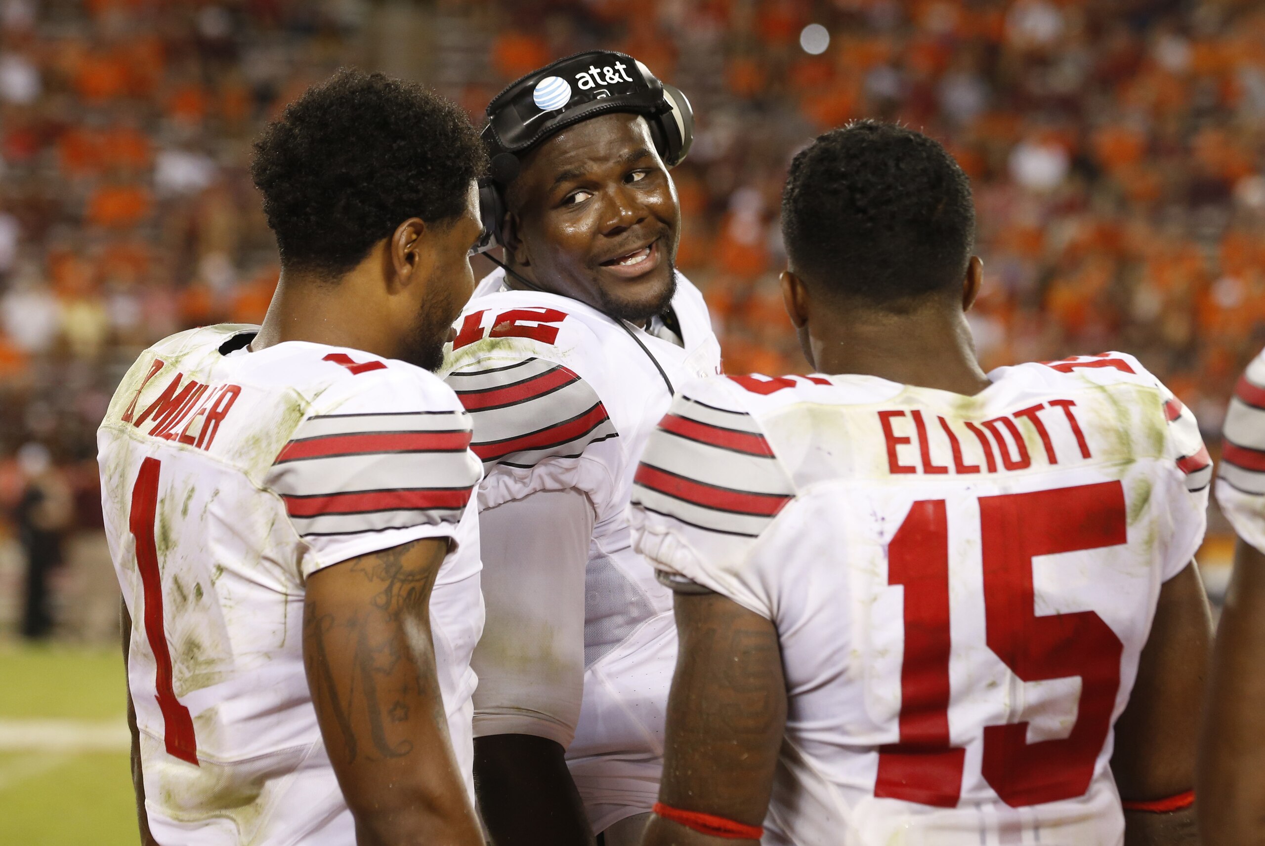 Ohio State quarterback Cardale Jones, center, talks with teammates Ezekiel Elliott (15) and Braxton Miller, left, during the second half of an NCAA college football game in Blacksburg, Va., Monday, Sept. 7, 2015. Ohio State won 42-24. (AP Photo/Steve Helber) Ohio State quarterback Cardale Jones, center, talks with teammates Ezekiel Elliott (15) and Braxton Miller, left, during the second half of an NCAA college football game in Blacksburg, Va., Monday, Sept. 7, 2015. Ohio State won 42-24. (AP Photo/Steve Helber)