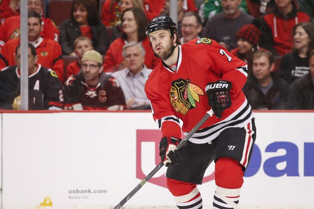 Chicago Blackhawks defenseman Brent Seabrook (7) looks to pass the pucks against the Minnesota Wild during the first period of an NHL hockey game Tuesday, April 7, 2015, in Chicago. (AP Photo/Kamil Krzaczynski)