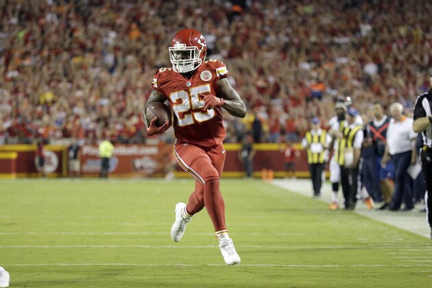 Kansas City Chiefs running back Jamaal Charles (25) runs for a touchdown during the first half of an NFL football game against the Denver Broncos in Kansas City, Mo., Thursday, Sept. 17, 2015. (AP Photo/Charlie Riedel)