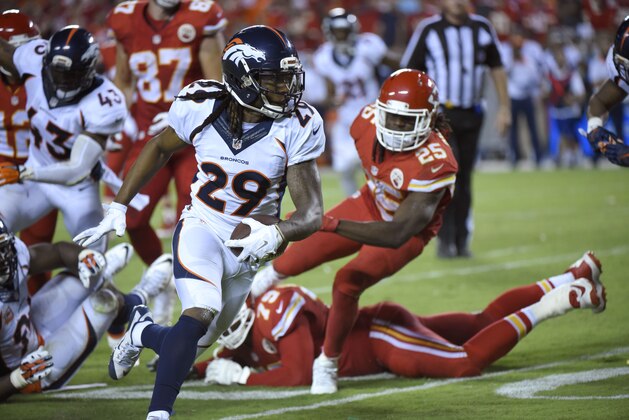 Denver Broncos cornerback Bradley Roby (29) runs for a touchdown after recovering a ball fumbled by Kansas City Chiefs running back Jamaal Charles (25) during the second half of an NFL football game in Kansas City, Mo., Thursday, Sept. 17, 2015. (AP Photo/Ed Zurga)
