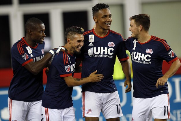 Sep 16, 2015; Foxborough, MA, USA; New England Revolution midfielder Diego Fagundez (14) celebrates with defender defender Jose Goncalves (23), forward Juan Agudelo (17) and midfielder Kelyn Rowe (11) during the first half against the New York Red Bulls at Gillette Stadium. Mandatory Credit: Greg M. Cooper-USA TODAY Sports Sep 16, 2015; Foxborough, MA, USA; New England Revolution midfielder Diego Fagundez (14) celebrates with defender defender Jose Goncalves (23), forward Juan Agudelo (17) and midfielder Kelyn Rowe (11) during the first half against the New York Red Bulls at Gillette Stadium. Mandatory Credit: Greg M. Cooper-USA TODAY Sports