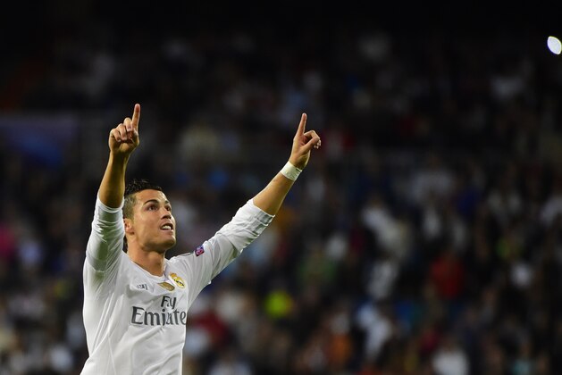 Real Madrid's Portuguese forward Cristiano Ronaldo celebrates his second goal during the UEFA Champions League group A football match Real Madrid CF vs FC Shakhtar Donetsk at the Santiago Bernabeu stadium in Madrid on September 15, 2015. AFP PHOTO/ PIERRE-PHILIPPE MARCOU        (Photo credit should read PIERRE-PHILIPPE MARCOU/AFP/Getty Images)