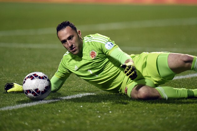 Colombia's goalkeeper David Ospina dives for the ball during the 2015 Copa America football championship quarterfinal match against Argentina, in Vina del Mar, Chile on June 26, 2015.  AFP PHOTO / JUAN BARRETO        (Photo credit should read JUAN BARRETO/AFP/Getty Images)