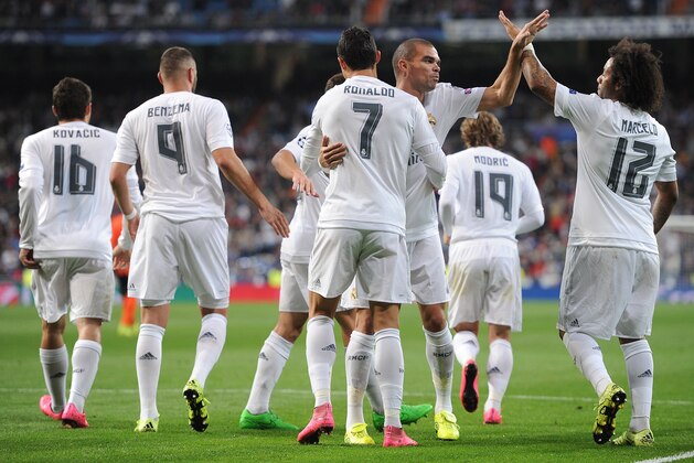 MADRID, SPAIN - SEPTEMBER 15:  Cristiano Ronaldo of Real Madrid celebrates with Pepe and Marcelo after scoring Real's 2nd goal from the penalty spot during the UEFA Champions League Group A match between Real Madrid and Shakhtar Donetsk at estadio Santiago Bernabeu on September 15, 2015 in Madrid, Spain.  (Photo by Denis Doyle/Getty Images)