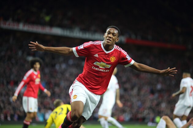 MANCHESTER, ENGLAND - SEPTEMBER 12:  Anthony Martial of Manchester United celebrates after scoring a goal to make it 3-1 on his debut during the Barclays Premier League match between Manchester United and Liverpool on September 12, 2015 in Manchester, United Kingdom.  (Photo by Matthew Ashton - AMA/Getty Images)