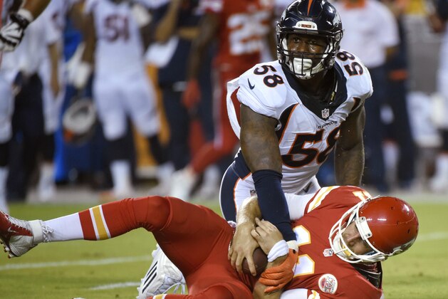 Denver Broncos linebacker Von Miller (58) kneels over Kansas City Chiefs quarterback Alex Smith (11) after sacking him during the first half of an NFL football game in Kansas City, Mo., Thursday, Sept. 17, 2015. (AP Photo/Ed Zurga)